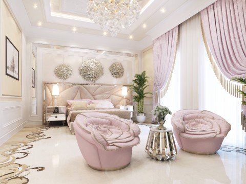 This picture shows a wooden bench in the middle of a large, lush garden. There are various flowers and plants scattered throughout the area, and a large tree is visible on the left side of the image. In the background, there is a fence and some other trees with bright green leaves.