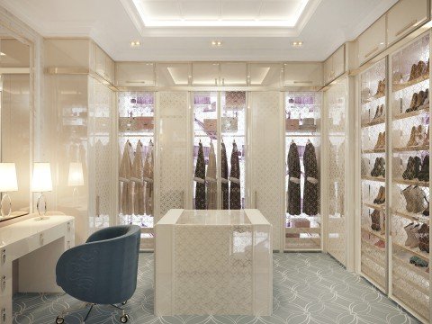 This picture shows a young woman in bright yellow rain boots and a colorful striped raincoat, standing in the middle of a rain-soaked street. She is smiling and looking up at the sky, seemingly enjoying the rain.