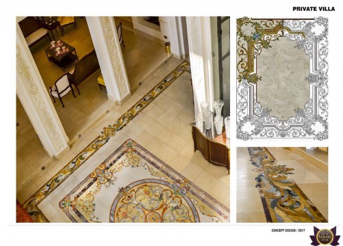 This picture appears to show a woman holding a small child in her lap as they both observe a colorful mosaic crafted onto the ground with intricate detail. The mosaic appears to be a representation of a sun, and is made up of various shades of blue, yellow, and orange tiles.