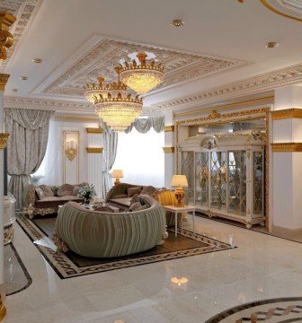 The picture shows a waterfall and pool surrounded by greenery. The water is cascading down the rock face into a deep, calm pool of water. The sun is setting in the background, creating a beautiful backdrop of pink, orange and yellow hues.