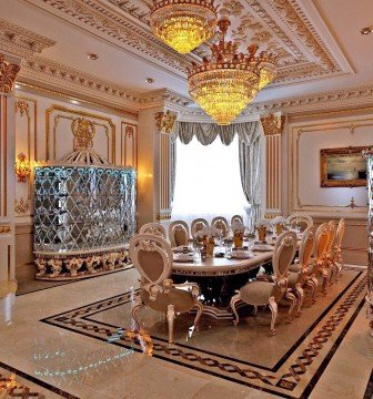 This picture shows a beautiful outdoor scene in the winter with a snow-covered forest, a frozen lake, and a clear blue sky. In the foreground, there is a family of deer standing in the snow.