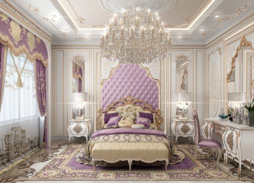 This picture shows a young woman wearing a pink shirt, blue jeans, and white sneakers. She is smiling and appears to be standing outdoors in front of a park or nature preserve. There are trees in the background and there is a path leading off into the distance.