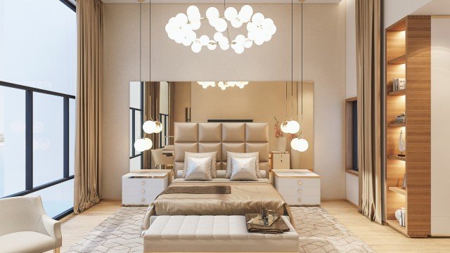 This picture is of a person wearing a black coat, standing on the beach with their feet in the water. The sky is a deep blue and the sun is setting, casting a warm orange glow over the horizon. The person looks relaxed and content, enjoying the peaceful moment before the sun sets.