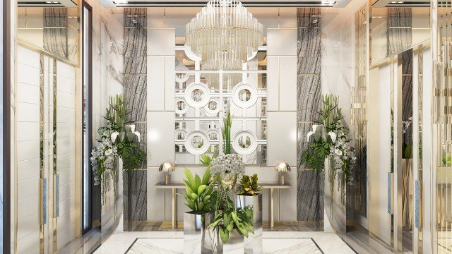 This picture shows a small, brown and white bird perched on a branch against a cloudy sky. It appears to be looking straight ahead, with its wings tucked close to its body.