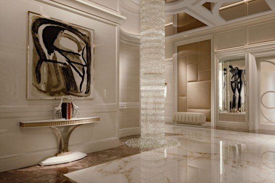 The picture shows a person wearing a blue and white stripped tank-top with black leggings, they are seated in a yoga studio with a yoga block in front of them. They have their right leg bent in an upward motion and their arms are extended above their head in the Warrior 1 yoga pose.