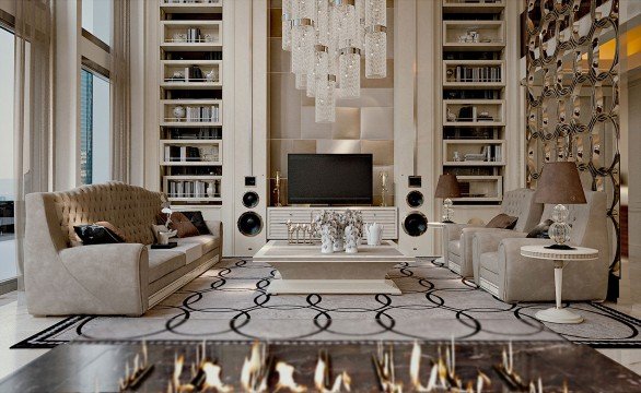 The picture is showing a group of people standing around a laptop computer, with one person typing on the keyboard. The people seem to be looking at the screen intently, and they appear to be taking part in some kind of training or discussion.