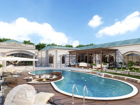 This picture shows a woman sitting in a large body of water with her eyes closed and arms outstretched. She appears to be meditating and is surrounded by a peaceful blue hue.