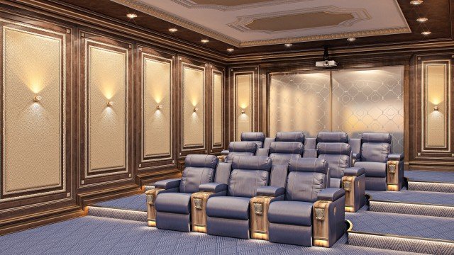 This image shows a luxurious and modern living room interior. It features beige walls, geometric-patterned wallpaper in grey and white, bright white ceiling and trim, and light wood floors. There is a white sofa with black and grey pillows, a glass coffee table with two ivory armchairs, and a grey Area rug that ties the room together. A large wall-mounted television with a bronze frame, and two side tables with neutral lamps add to the design.