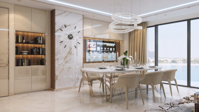 This picture is of a modern luxury bedroom designed by Antonovich Design. It features a luxurious bed with pink bedding, a white tufted headboard and gold trim. There are also several accent pieces such as a small decorative table, a white armchair, and a large pouf. The walls are painted with a light beige color and are accented with gold frames and art on the walls. The room has a lot of natural light coming in from the windows and has several ornate lamps for additional lighting.