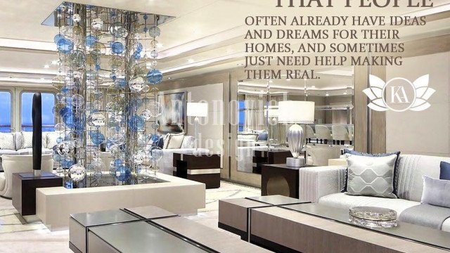 A luxurious living room with golden accents, creme wall paint, and a chandelier.