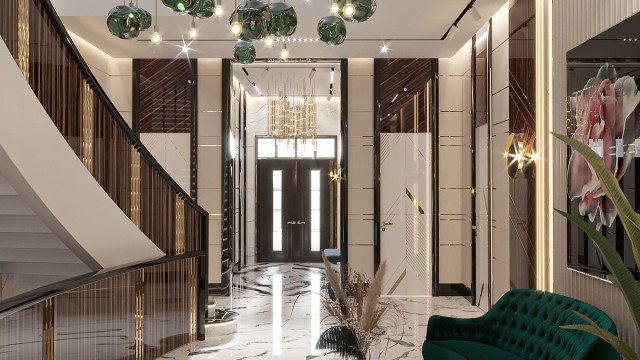 This picture is of a modern luxury bedroom. The room is decorated with white walls, plush cream carpets, and rich dark-wood furnishings. The bed is covered in a rich textured duvet with a selection of pillows arranged across the top. A luxurious velvet armchair stands in one corner of the room, and a low table sits at the foot of the bed. On either side of the bed are tall contemporary lamps, and an ornate mirror hangs on the wall above.