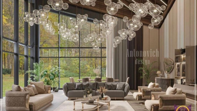 This picture shows a modern interior design, featuring a white sofa, black and white chairs, and a light grey rug. There is a large wall-mounted television, as well as several smaller accent pieces, such as a round coffee table, standing lamps, and a grey credenza in the background. The overall design is minimalist and contemporary, with clean lines and subtle pops of color.