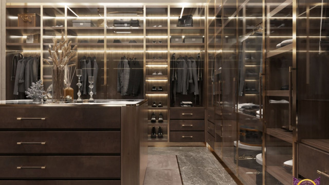 This image shows a luxurious living room with a grand piano and several sophisticated seating pieces. The walls are painted a deep navy blue and are adorned with art pieces and tall, ornate mirrors. There is also a large window, looking out to a garden beyond. The floor is a light-colored, polished wood and several elegant end tables complete the look.