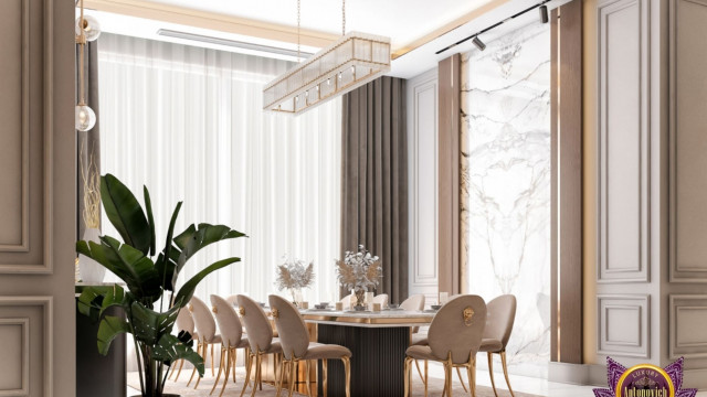 This picture shows the interior of a contemporary living room. The room is decorated with sleek, modern furniture and decorative accents in neutral shades, including light grey walls, a white sofa, and a black, glossy coffee table. On one side of the room is a contemporary fireplace, with a surrounding mantlepiece that is decorated with art pieces and plants.