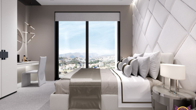 A contemporary interior with a marble floor, furniture in a pale palette and indirect lighting.