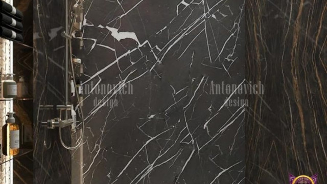 Modern open-plan kitchen with marble countertops, integrated appliances and luxurious materials.