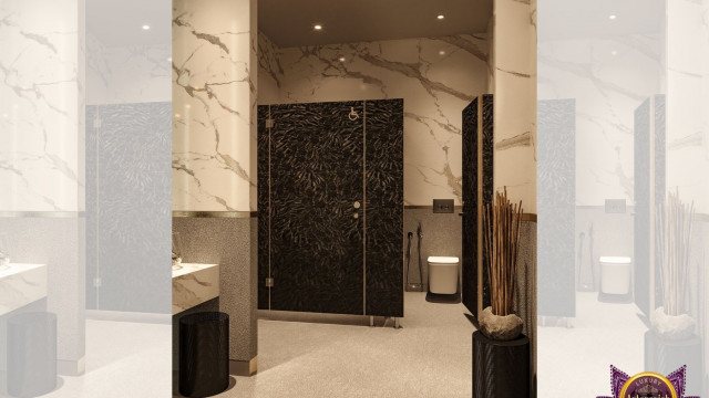 Modern styled interior with a curved ceiling, featuring a chandelier and recessed lighting in white and gold.