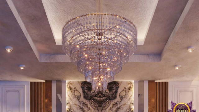 Modern living room with monochromatic color scheme featuring large L-shaped sectional sofa, fireplace, and multiple accent pieces.