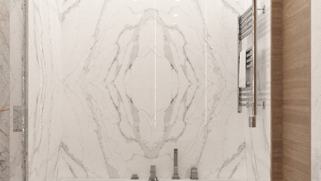 In this picture, an impressive luxury bathroom is featured. It has a large, white porcelain Jacuzzi tub with gold fixtures, a large shower stall with a modern rain showerhead, and a quartz countertop with a double sink. The walls are tiled in a marble pattern with a large window providing lots of natural light. There is also a built-in bench for seating and a crystal chandelier hanging from the ceiling for extra glamour.