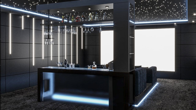 This picture shows an outdoor terrace design with a modern luxury feel. The terrace features comfortable seating, a pool surrounded by lush greenery, and numerous lights hanging from above to illuminate the area. A few large potted plants provide some privacy, while stone pathways add texture throughout the space. Overall, this terrace has a sophisticated and inviting atmosphere.