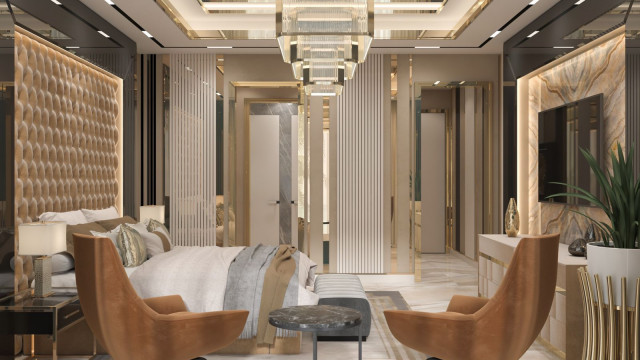 This picture shows an interior design that features a luxurious and elegant living room with dark wood walls, floors and furniture. The room has two large couches facing each other and a round decorative coffee table in the center. There is a white leather armchair in the corner and an ornate chandelier hanging from the ceiling. A tall window looks out on a garden, giving the space an inviting natural atmosphere.