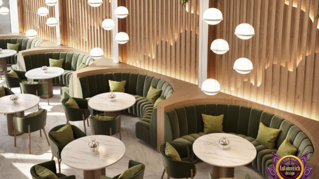 An intricately crafted baroque style ceiling with ornate gold patterning and detailed mouldings.