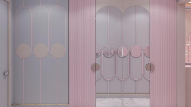 This picture shows a contemporary luxury dining room. The room features a large, round marble dining table with a patterned marble top in the center. There are six white chairs around the table, each upholstered in a luxurious fabric. The walls are painted a warm shade of grey, and a modern chandelier hangs from the ceiling. A large abstract painting hangs on one of the walls, adding a sophisticated accent to the overall design.