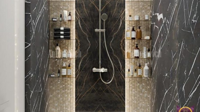 A grand staircase in a luxurious home, featuring intricate wrought iron balusters and railings on either side, a marble stair tread with ornamental mosaic inlay, and lavish chandelier.