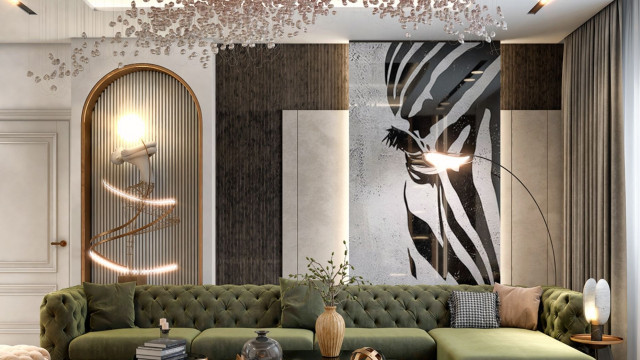 The picture shows a luxurious, modern living room with a stylish and sophisticated design. The furniture features a light brown leather sofa and armchair, along with a contemporary glass coffee table and an ottoman. The walls are a neutral white color, while the floor is covered in a light beige carpet. A large window with a white frame allows natural light to fill the room, while two large pendant lights hang from the ceiling. The overall design is completed with a few pieces of art and decor, such as a framed painting and some decorative vases.