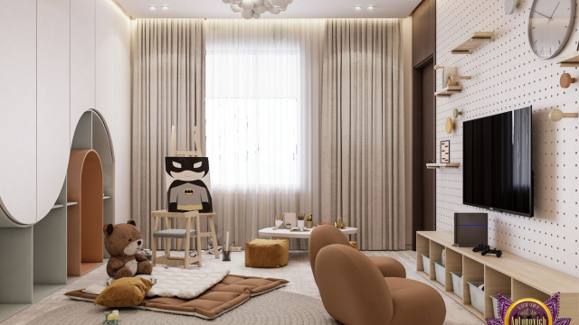 This picture shows a beautiful and luxurious modern bathroom design created by Antonovich Design. The walls feature a taupe marble mosaic with a suspended vanity illuminated by two glass wall sconces. There is a freestanding soaking tub with a gold trim and overhead rain showerhead. The flooring is a warm gray tile with a unique patterned area rug to add a touch of sophistication.