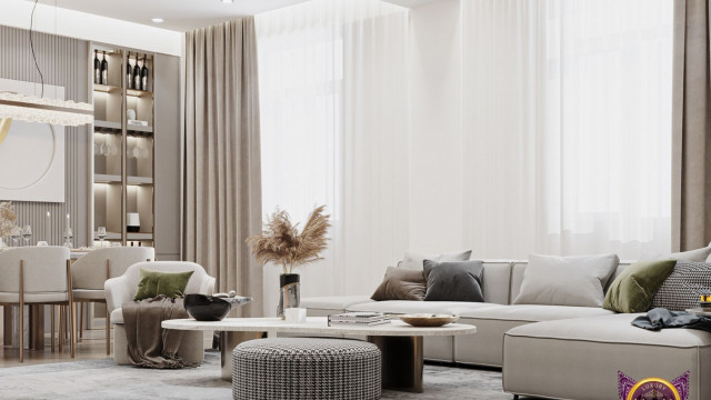 This picture shows a modern and luxury bathroom design. It features marble walls, a large whirlpool bathtub, two sinks, and two large mirrors. The floor is made of pebbles and there is a bench on the side for added seating. A wide glass shower stall is located on the opposite side of the room from the bathtub. The room is finished with warm lighting, giving it a cozy atmosphere.