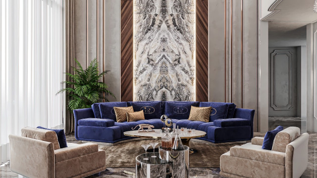 The image shown is of a modern luxury living room. The room features a grey couch, a white accent chair, and a round black coffee table. There is a large rectangular area rug with a grey and white diamond pattern and a navy blue wall. Hanging on the wall is an abstract painting with blue, white, and grey tones. The walls are also decorated with small shelves filled with books, vases, and house plants.