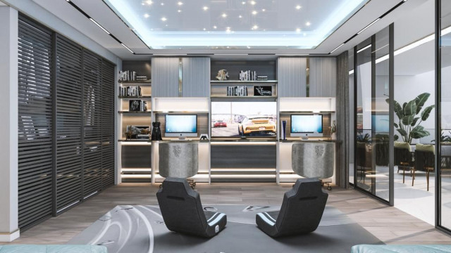 This picture shows an indoor living space with a natural, contemporary design. The room features a modern grey and beige sofa, a black and white abstract patterned armchair, a large glass coffee table, and a white media console. The walls are adorned with artwork and the floor is covered with a plush, patterned rug. There are also a few small potted plants placed throughout the room to bring a touch of greenery.