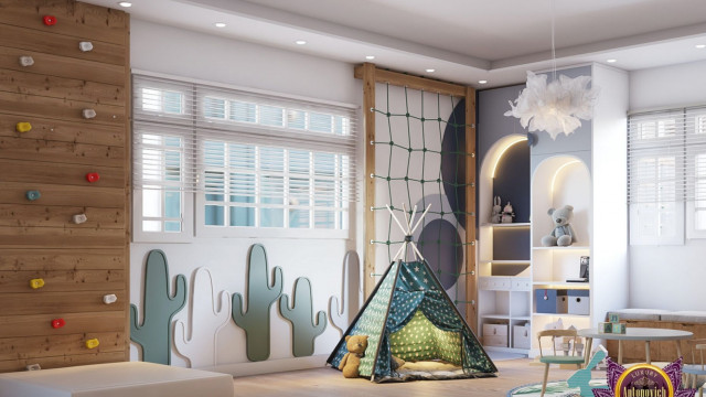 This picture shows a luxurious master bedroom with modern and elegant decor. The room features a corner fireplace, large windows overlooking a cityscape, and a black tufted bed with white linens. A plush gray velvet armchair is placed on the side of the fireplace, along with a white and gold end table. In the background, a grand chandelier hangs from the ceiling, adding the perfect touch of drama to the room.