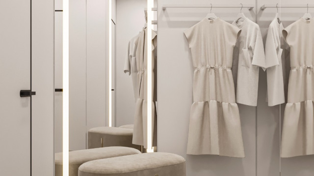 Luxurious, marble-tiled bathroom featuring ornate tub and vanity backsplash with antique wall mirror.
