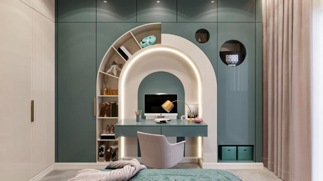 This picture shows a large, elaborate living room with a luxurious design. The walls and ceiling feature intricate moldings and decorations, while the floor has a checkerboard parquet pattern with gold-colored accents. The furniture is comprised of a lavish cream-colored sofa with tufted detailing and pillows, two ornate chairs, and a low glass coffee table. A crystal chandelier hangs from the center of the ceiling, adding a sparkle to the room.