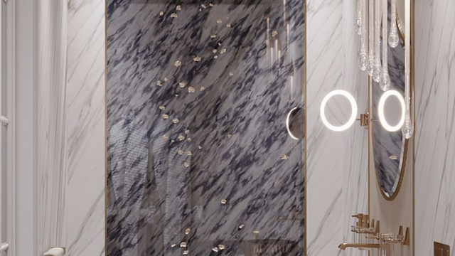 This picture shows a luxurious kitchen designed in a modern style. In the center of the room there is an island with a sink and two ovens, as well as a countertop and storage space. The cabinets are a light cream color, while the countertop is a dark granite material. The walls are a bright white color and there are two large windows that provide natural lighting. There is also a chandelier hanging from the ceiling which adds a touch of glamour to the space.