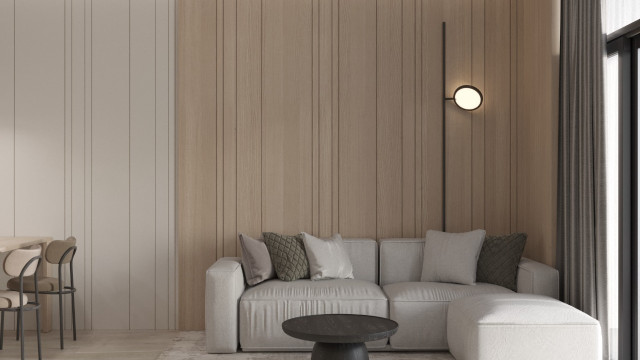 The picture shows a luxurious modern living room designed in a contemporary style. There are two white sectional couches and a glass coffee table in the center of the space. The walls are painted in a light blue color, with large windows providing natural light. On the wall above the sectional is a large abstract art piece that adds a contemporary touch to the design. There are rug and light brown wood flooring, along with some potted plants in the corner to add a hint of greenery.