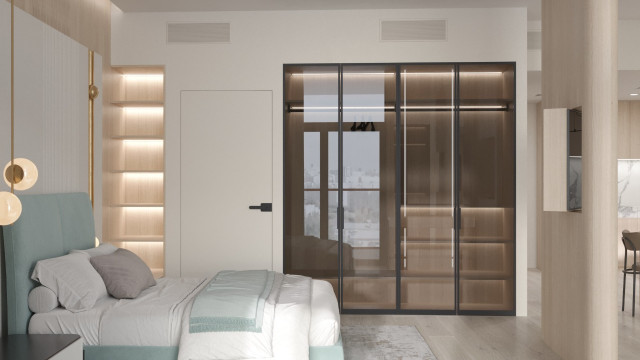 Modern luxury bedroom featuring a wooden bed frame, tufted headboard, and nightstands with ornate lamps.