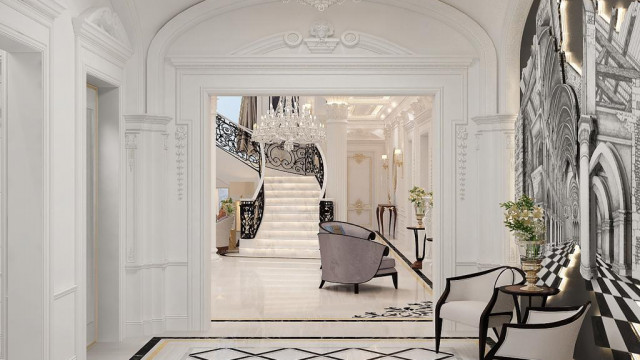 Modern interior with geometric wall pattern featured in pastel shades, and beige marble flooring.