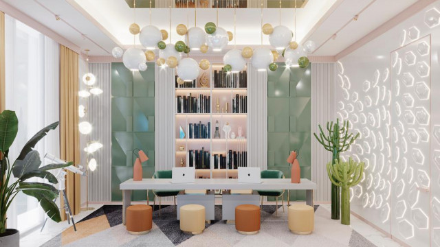 This picture shows an elaborate staircase and landing in a luxurious home. The staircase itself is constructed of wood, with metal railings and ornately carved accents in the balustrades. The landing area is decorated with a luxurious oriental rug, a large crystal chandelier, and a grand painting above the stairs.