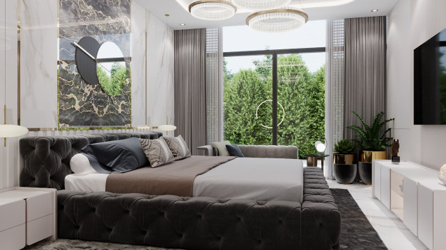 This picture shows a modern and luxurious living room. The room features warm neutral colors, a plush off-white rug, and stylish designer furniture. There is a large sectional sofa in the center of the room, and two round chairs flanking it. On the left side of the room, there is an upholstered armchair and ottoman and a pair of floor-to-ceiling windows that provide plenty of natural light. The right wall features a large painting and ornate chandelier. There is also a large flat-screen TV mounted on the wall.