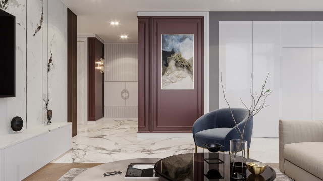 Modern living room featuring a luxurious velvet sofa, armchair and ottoman, an ornate marble fireplace, and intricate wall decor.