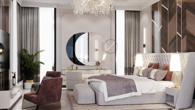 A luxurious living room with a grand ceiling design, marble flooring, and ornate furniture.