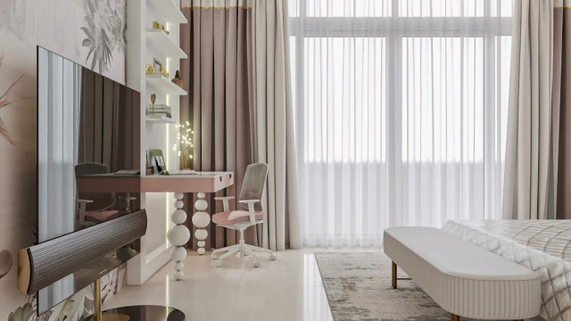 A luxurious bedroom with a large canopy bed and an upholstered headboard. The room is decorated with a crystal chandelier and art prints.