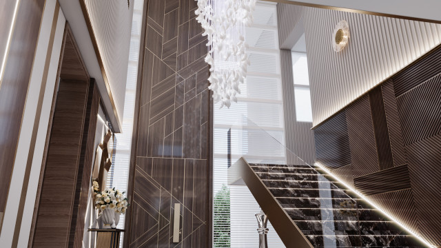 Modernly-designed room consisting of grey walls, a large window overlooking the cityscape and a light grey sofa with accompanying armchairs and side table.