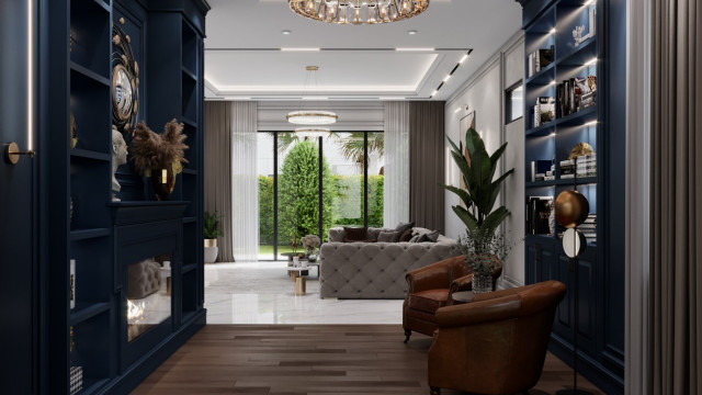 The picture shows a luxurious living room with two large burgundy sofas, two chairs, a large glass coffee table, and an ornate gold mirror set on the wall. The walls are painted a deep red color, while the floor is covered with a light-colored wood laminate. There is a round glass chandelier above the seating area and curtains that hang from the ceiling. The overall effect is elegant and sophisticated.