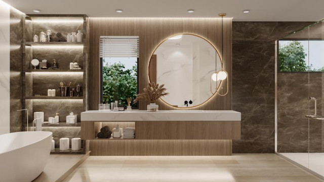 This picture depicts a contemporary, luxury interior design. It showcases a large open-plan space with tall double-height ceilings, wood flooring, and stylish dark wooden furniture. There is a comfortable seating area around a grand fireplace, with a warm, beige color scheme. The main focal point of the room is an impressive crystal chandelier, suspended from the ceiling. On the walls, there are modern art pieces and a large television mounted above the fireplace.