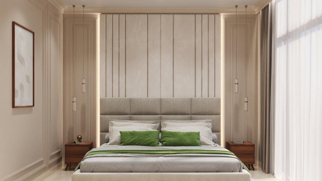 This picture is of a modern, luxury home designed by Antonovich Design. The home features white stucco walls with black and grey accents, surrounded by lush greenery and palm trees. There is a large patio area with a seating area and a swimming pool in the center. The large, glass windows give the house a light and airy feel, while the dark colors create a sophisticated and contemporary atmosphere.