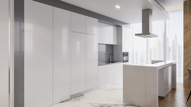 This picture shows a modern bedroom designed by Antonovich Design. The room features a large, king-sized bed with a white velvet headboard and luxurious gray and gold accents. The walls are painted a soft gray shade, with white moldings providing a clean and sophisticated accent. The room is finished off with a beautiful glass chandelier hanging above the bed and two minimalist nightstands on either side.
